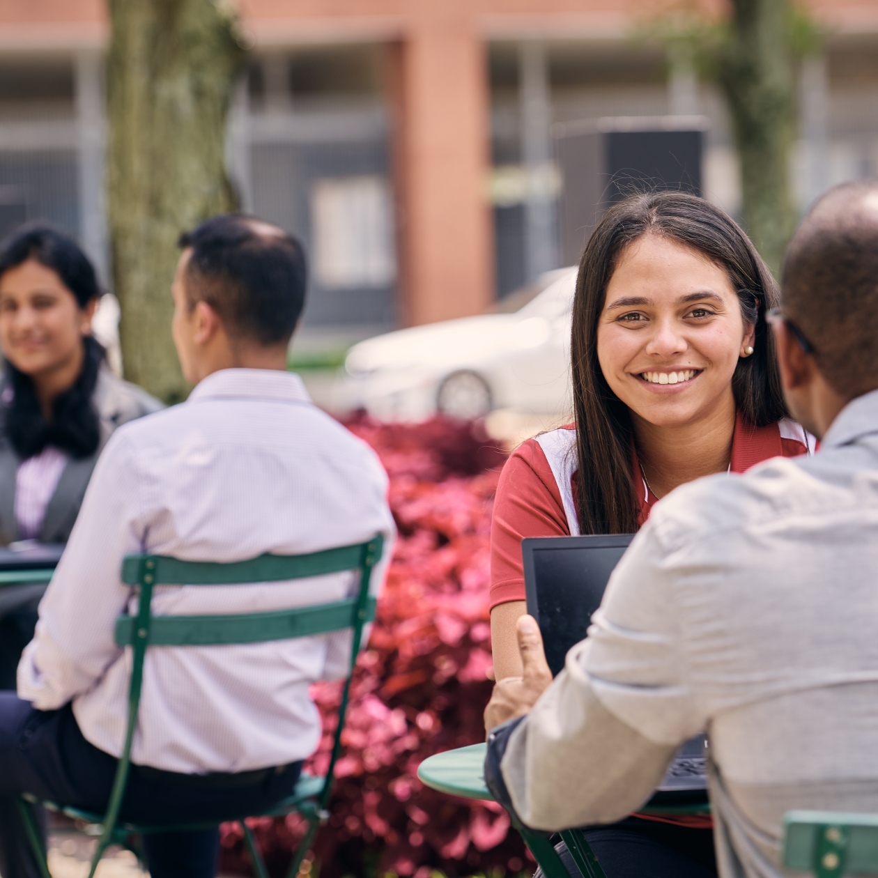 Cummins employees enjoy a meeting outside